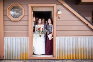 bride and bridesmaids in doorway of hotel room in Durango Colorado