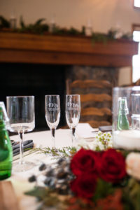 Mr. and Mrs. champagne glasses at winter wedding in durango colorado