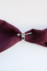 diamond engagement ring and wedding rings ring shot with merlot