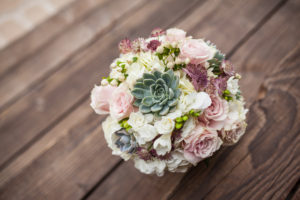 succulent wedding bouquet with pink roses