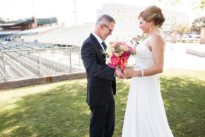 first look with bride and groom in baseball stadium