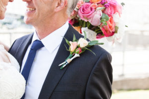 groom with golf tee boutonniere
