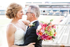 bride and groom in baseball stadium scottsdale arizona wedding