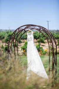 Lace sheath wedding dress with lace straps in temecula vineyard wedding