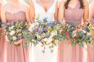 Bride and blush bridesmaids desert wedding large succulent bouquet