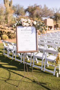 wedding ceremony florals on Welcome sign