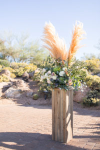chasing bliss designs wedding ceremony floral arrangement